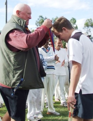 Our young gun: Alex Gorham receives his Premiership medal from Ralph Barron. Our young gun: Alex Gorham receives his Premiership medal from Ralph Barron.