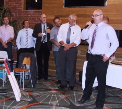 The man of the moment speaks: Michael Cumbo takes the microphone to respond after receiving his Life Membership, flanked by Life Members (L-R) Jim Polonidis, Danny Terzini, Kevin Gardiner, Sandro Capocchi and Charlie Walker. The man of the moment speaks: Michael Cumbo takes the microphone to respond after receiving his Life Membership, flanked by Life Members (L-R) Jim Polonidis, Danny Terzini, Kevin Gardiner, Sandro Capocchi and Charlie Walker.