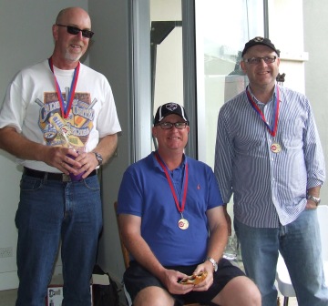 They've got the medallions to show for it! L-R Kevin Gardiner, Dean Lawson and Paul Hobbs. They've got the medallions to show for it! L-R Kevin Gardiner, Dean Lawson and Paul Hobbs.