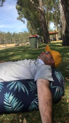 All too much after a hard day at the cricket: Michael Cumbo asleep at Thompson's Beach on the Murray. All too much after a hard day at the cricket: Michael Cumbo asleep at Thompson's Beach on the Murray.