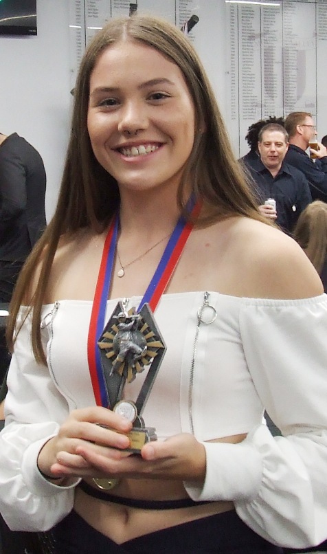 Tara Newman with her Most Improved Player award - and her Premiership medallion. Tara Newman with her Most Improved Player award - and her Premiership medallion.