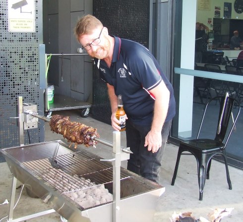 Master chef Dean Lawson checks on the spit roast outside the pavilion. Master chef Dean Lawson checks on the spit roast outside the pavilion.