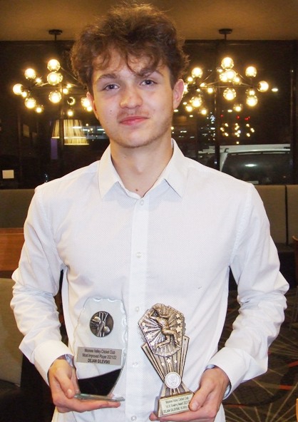 Dejan Gilevski shows off his two trophies - the Most Improved Player award and the First Eleven bowling trophy. Dejan Gilevski shows off his two trophies - the Most Improved Player award and the First Eleven bowling trophy.