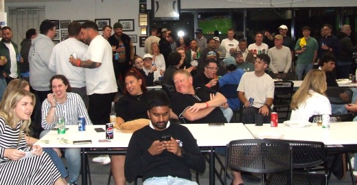 A view of the gathering watching the raffle draw. A view of the gathering watching the raffle draw.