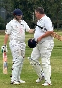 Geoff Smith (right) gives some advice to son Lachlan as he goes in to bat. Geoff Smith (right) gives some advice to son Lachlan as he goes in to bat.