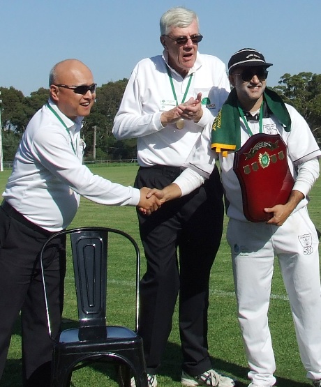Captain Sunny Sharma receives the premiership shield and flag from umpires Wilson Chan (left) and Graham Slater. Captain Sunny Sharma receives the premiership shield and flag from umpires Wilson Chan (left) and Graham Slater.