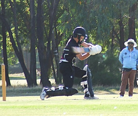Dejan Gilevski hits out, watched by umpire Tarek Patel. Dejan Gilevski hits out, watched by umpire Tarek Patel.