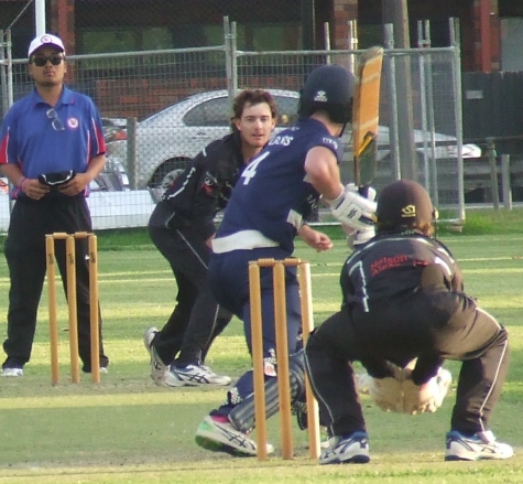 Tain Piercy bowls, with Henry Thomas behind the stumps and Marcus Lee umpiring. Tain Piercy bowls, with Henry Thomas behind the stumps and Marcus Lee umpiring.